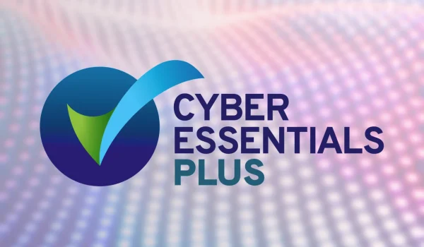 A greyscale visual of Cyber Essentials Plus' logo on a wavy background.