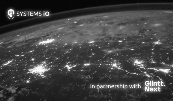The world as seen from space, in black and white, with cities lit up at night and the Systems iO logo and Glintt Next's logo