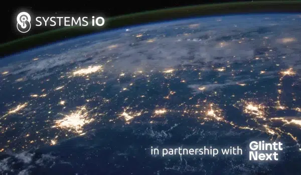 The world as seen from space, in colour, with cities lit up at night and the Systems iO logo and Glintt Next's logo.