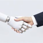 A handshake between a robot and a (human) businessman.