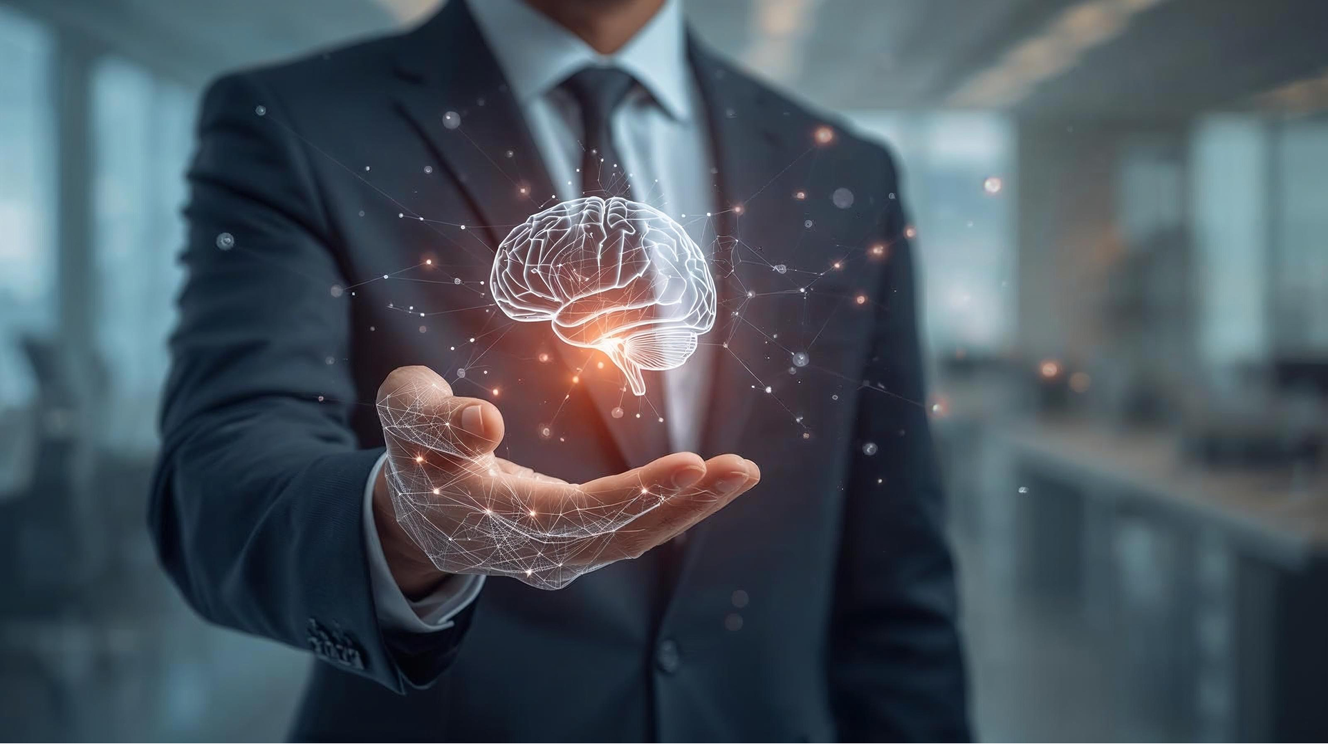 A businessman holds in his hand a holographic brain.