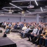 Christian Kitchen (CIO UK, Marsh) delivers an opening keynote in a packed conference hall.