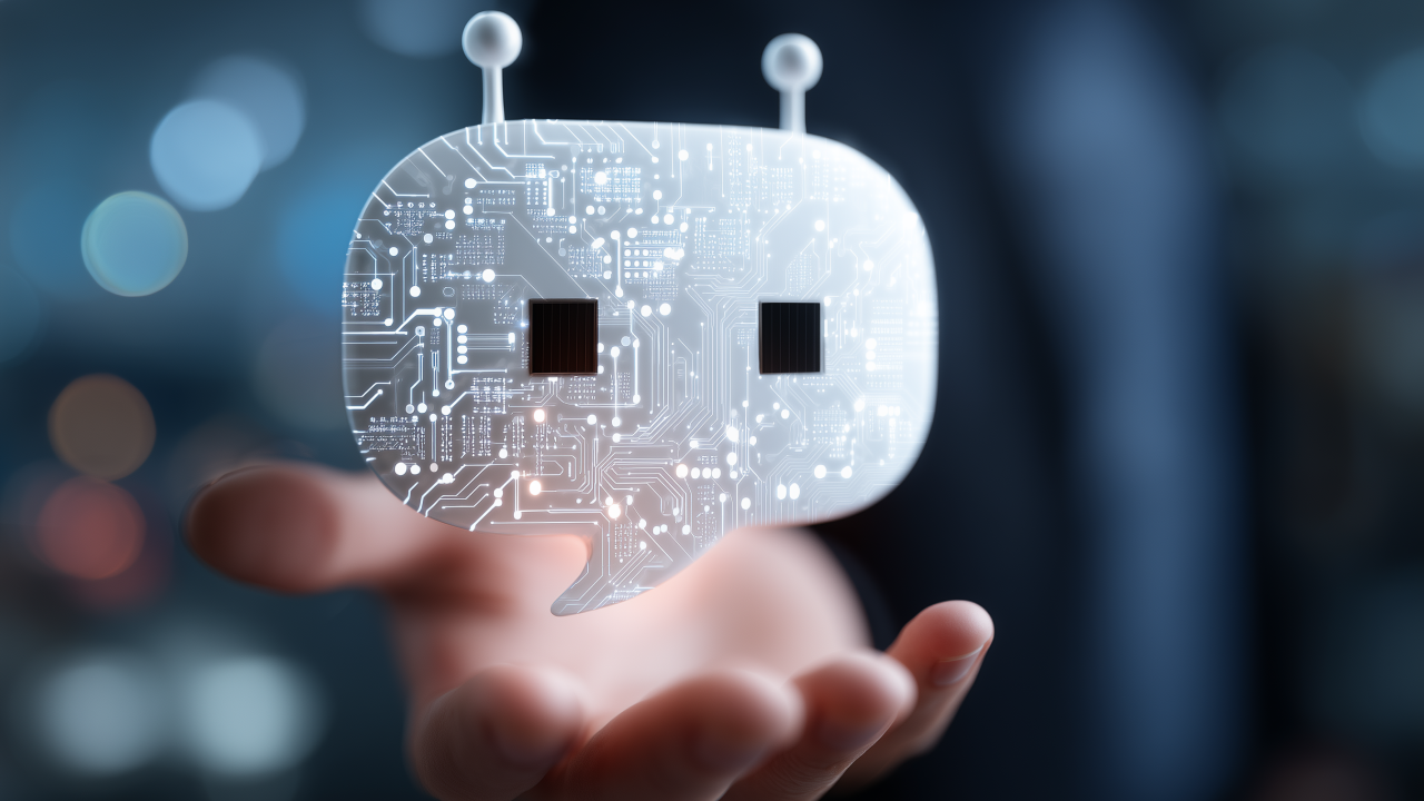 A holographic chatbot hovering in the palm of a human hand.